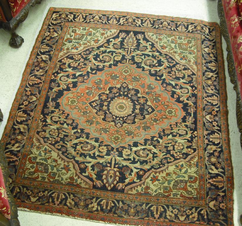 Appraisal: Small Persian rug worked with a central stylised floral medallion