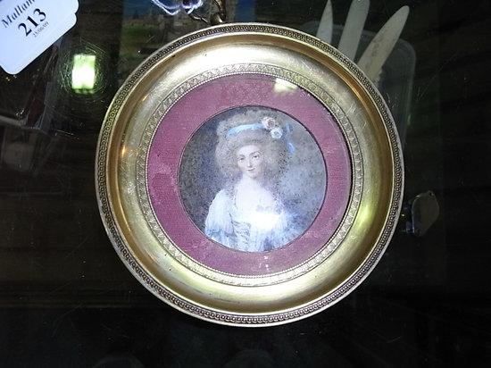 Appraisal: A WATERCOLOUR CIRCULAR MINIATURE PORTRAIT of a lady in th