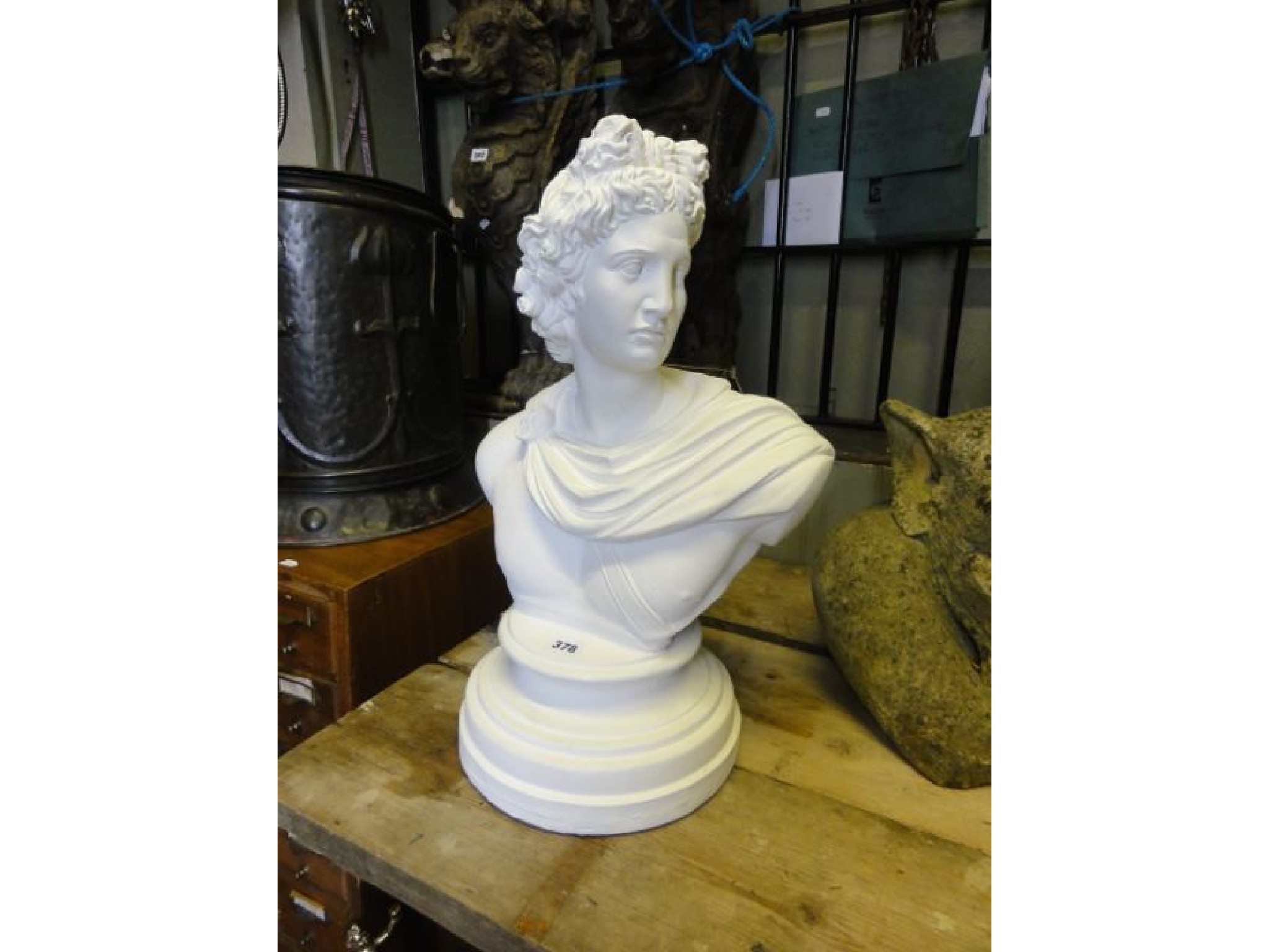 Appraisal: A contemporary cast composite to simulate marble head and shoulder