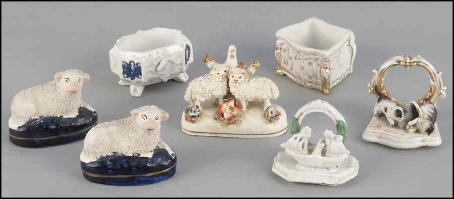 Appraisal: PAIR OF STAFFORDSHIRE PORCELAIN RECUMBENT SHEEP Together with a Staffordshire