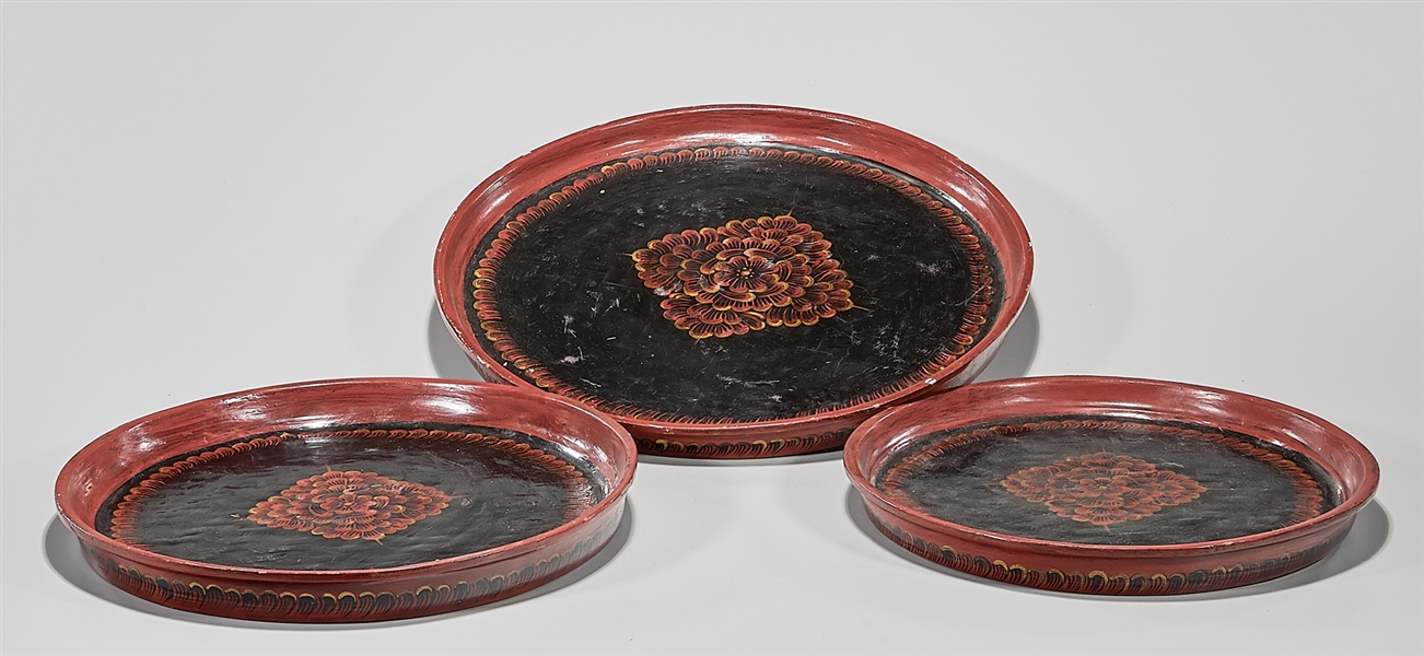 Appraisal: Three Chinese lacquered trays with painted flower design D largest