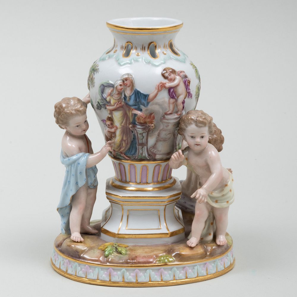 Appraisal: Meissen Porcelain Figure Group of Putti and a Classical Vase