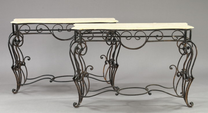 Appraisal: Pair of Mediterranean-Style Wrought-Iron and Marble-Top Console Tables the serpentine