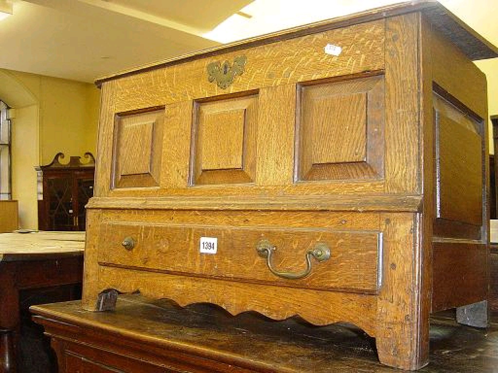 Appraisal: An th century oak coffer bach with panelled frame over