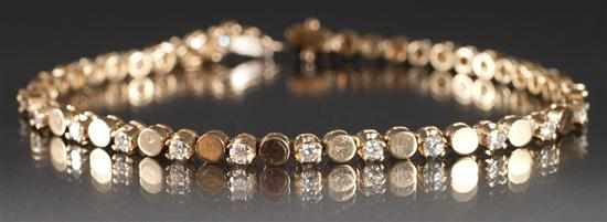 Appraisal: Lady's K yellow gold and diamond tennis bracelet diamonds approximately