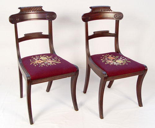 Appraisal: PAIR CARVED MAHOGANY EDWARDIAN SIDE CHAIRS Top rails curve out