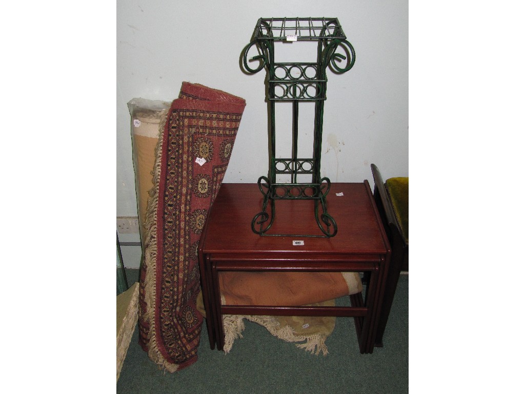 Appraisal: Lot comprising three rugs wrought iron stand and a nest