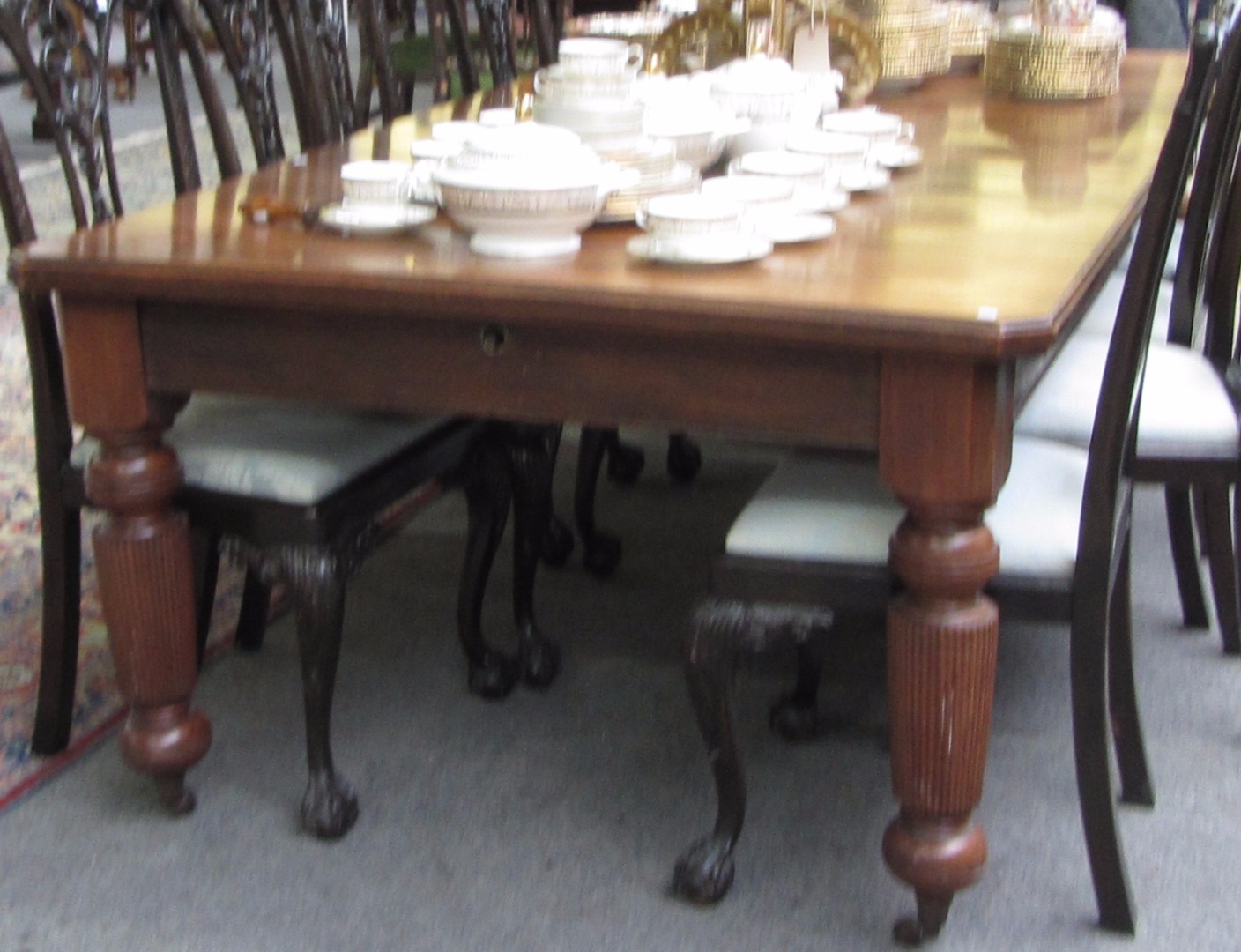 Appraisal: A Victorian walnut extending dining table with canted rectangular top