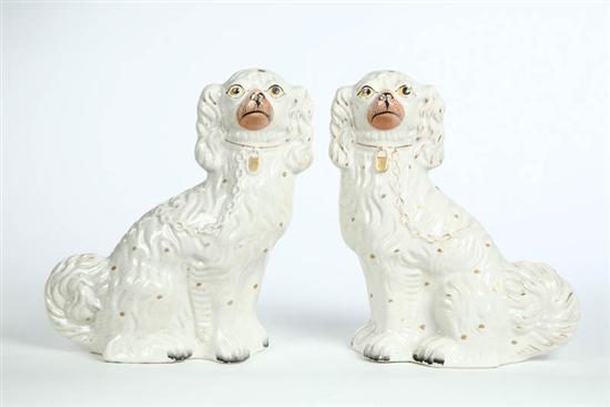 Appraisal: PAIR OF STAFFORDSHIRE DOGS Facing dogs with gilt chains collars