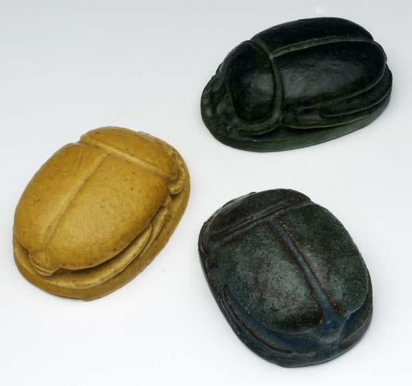 Appraisal: GRUEBY Three scarab paperweights in mustard green and blue matte