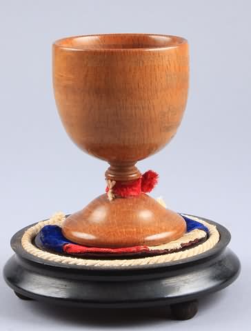 Appraisal: Wooden carved cup measuring tall with painted presentation on front