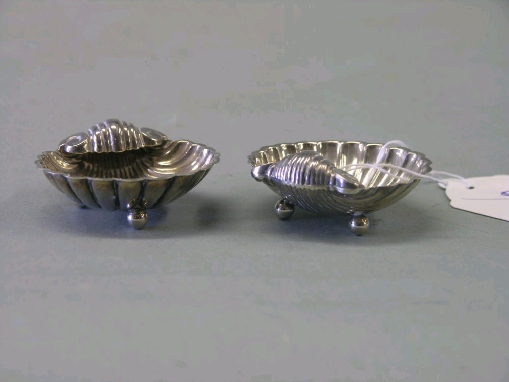 Appraisal: A pair of Edward VII silver salts each in the