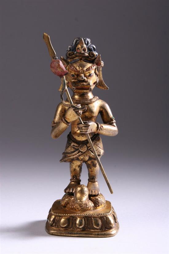 Appraisal: TIBETAN GILT BRONZE FIGURE OF DEITY th th century Animal-headed