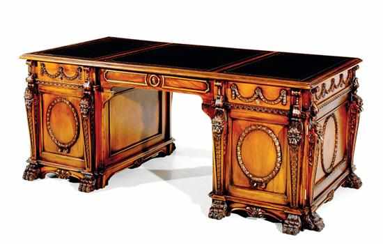 Appraisal: Regency style carved mahogany partner's desk leather-inset rectangular top above