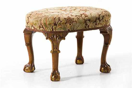 Appraisal: Chippendale style mahogany upholstered footstool late th century oval overupholstered