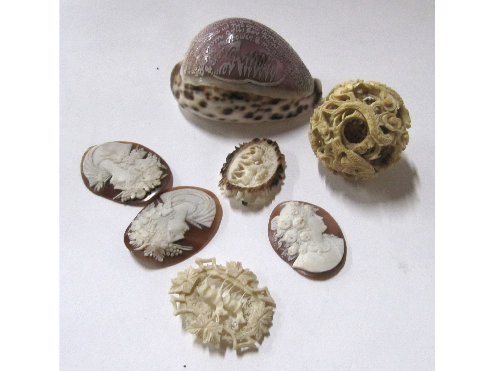 Appraisal: A lot comprising a carved shell a puzzle ball three