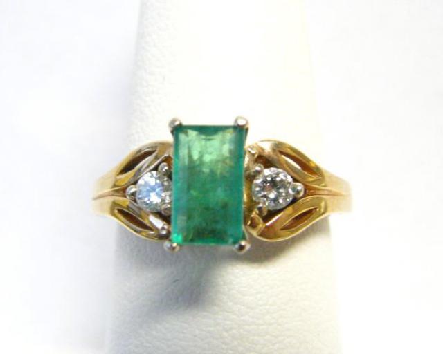 Appraisal: Lady's K yellow gold with rectangular cut emerald and two