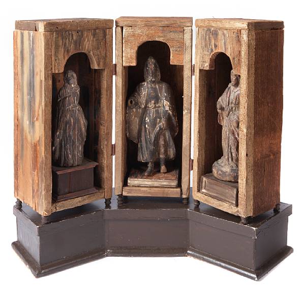 Appraisal: A group of three Continental carved figures of saints in