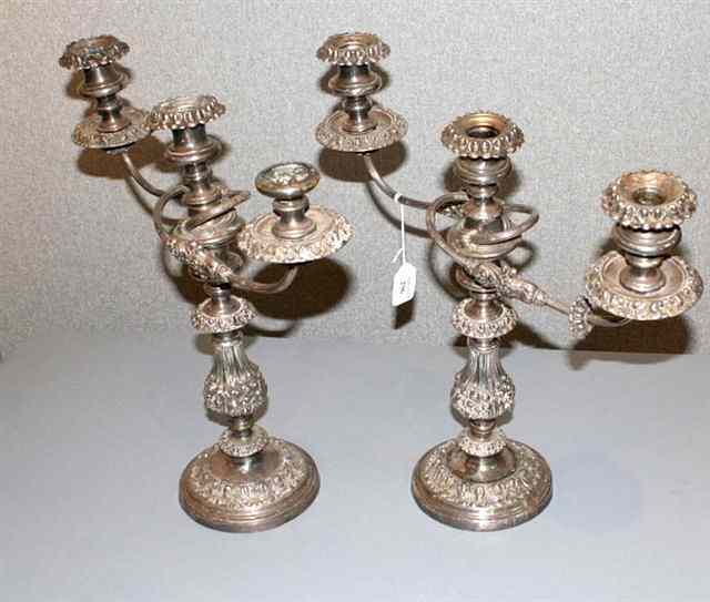 Appraisal: A PAIR OF SILVER PLATED THREE LIGHT TWO BRANCH CANDELABRA