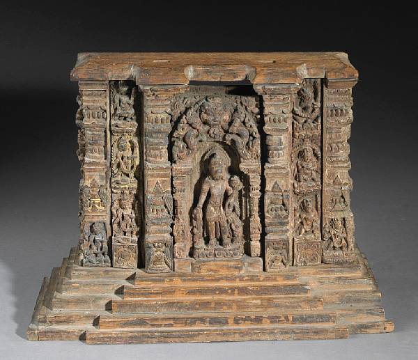 Appraisal: A pieced and carved wood shrine Nepal th th Century