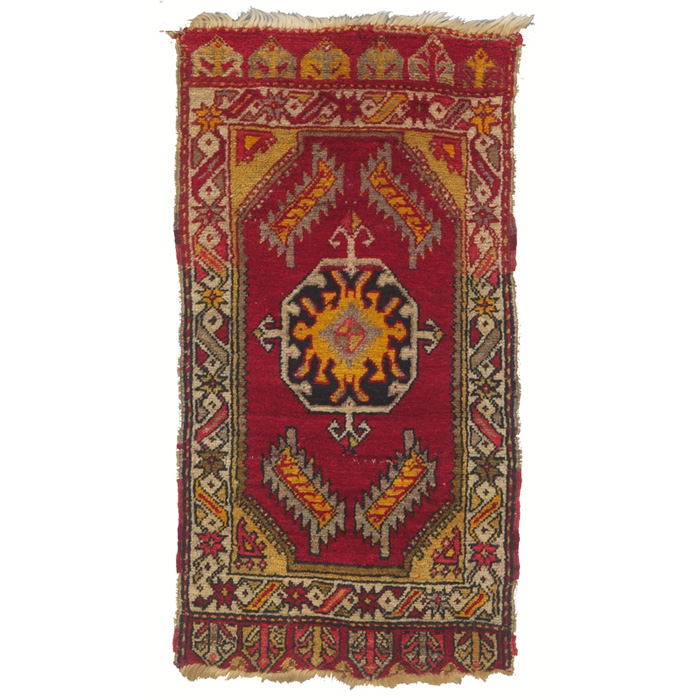 Appraisal: Turkish rug c central medallion on a red field some