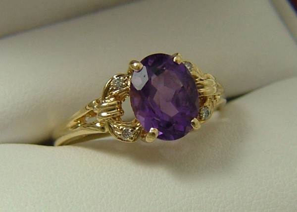 Appraisal: AMETHYST AND DIAMOND RING K yellow gold set with an