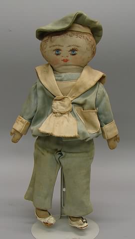 Appraisal: Unmarked one-of-a-kind boy doll Hand painted features and hair Dressed