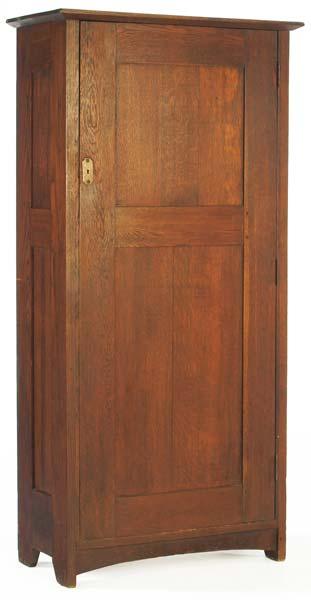 Appraisal: GUSTAV STICKLEY Wardrobe with paneled door and sides fixed interior