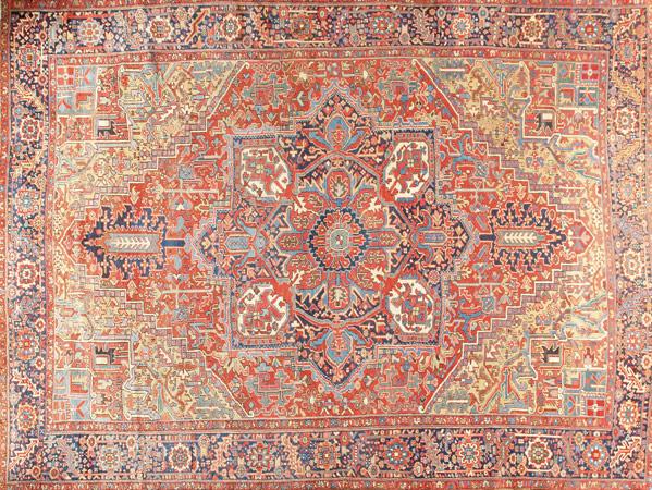 Appraisal: HERIZ ORIENTAL RUG With red background and repeating geometric design