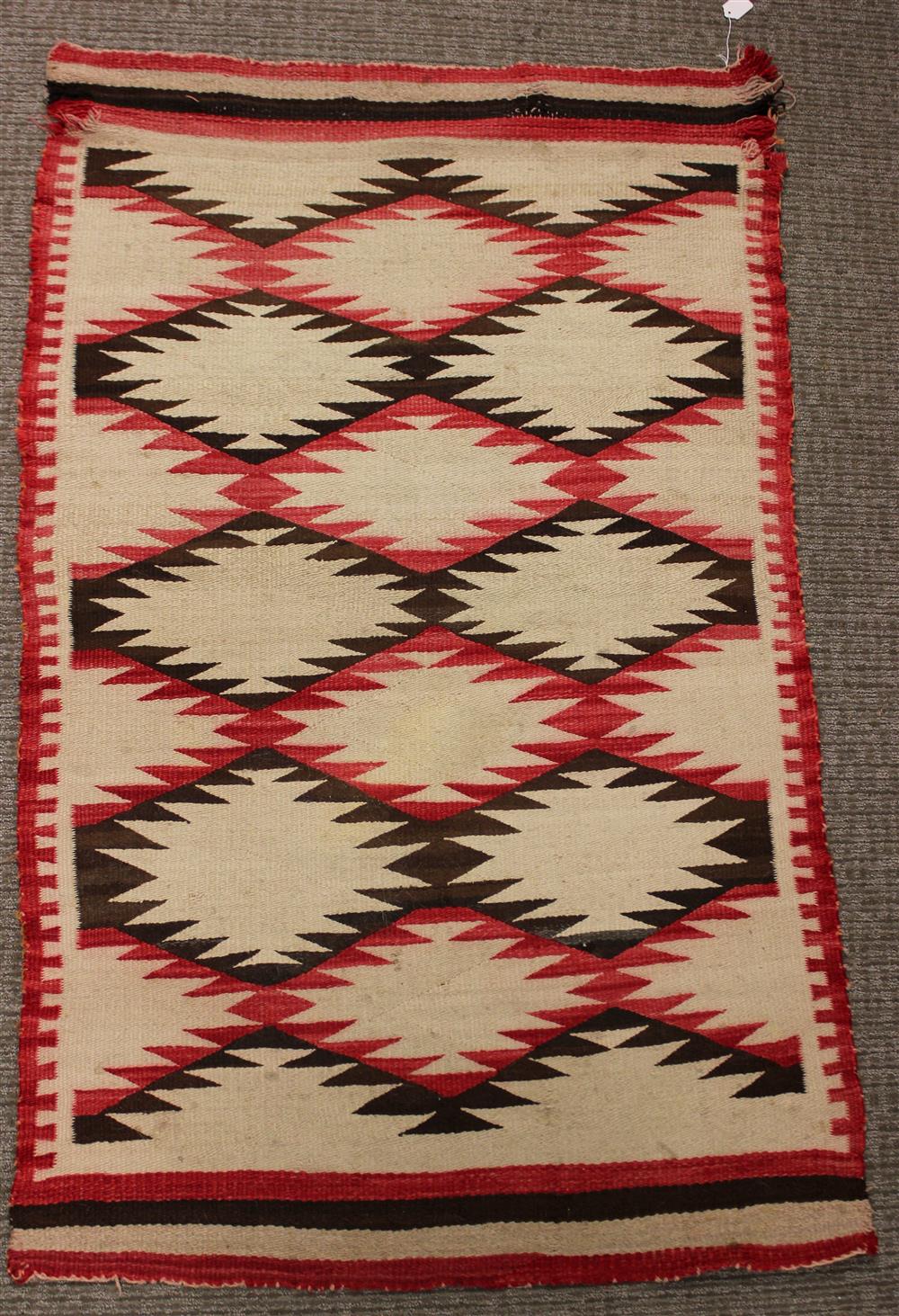 Appraisal: NAVAJO WEAVING natural and analine dyed wool field of brown