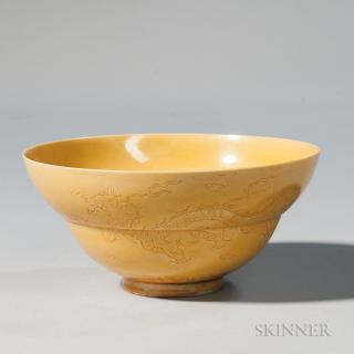 Appraisal: Yellow-glazed Dragon Bowl Yellow-glazed Dragon Bowl China possibly th century