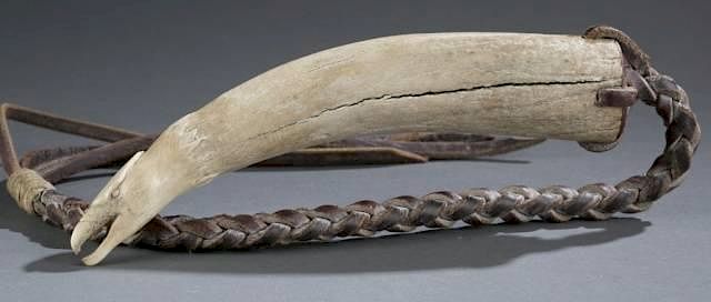 Appraisal: Carved walrus tusk Scrimshaw whip A carved walrus tusk in