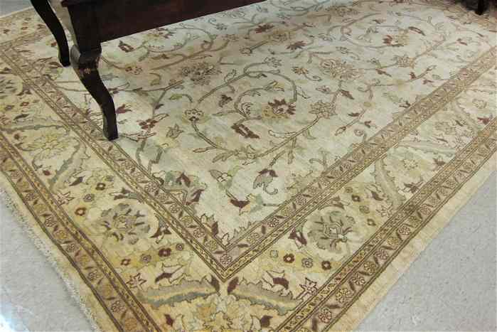 Appraisal: HAND KNOTTED ORIENTAL CARPET Pakistani Oushak overall scrolling floral tracery