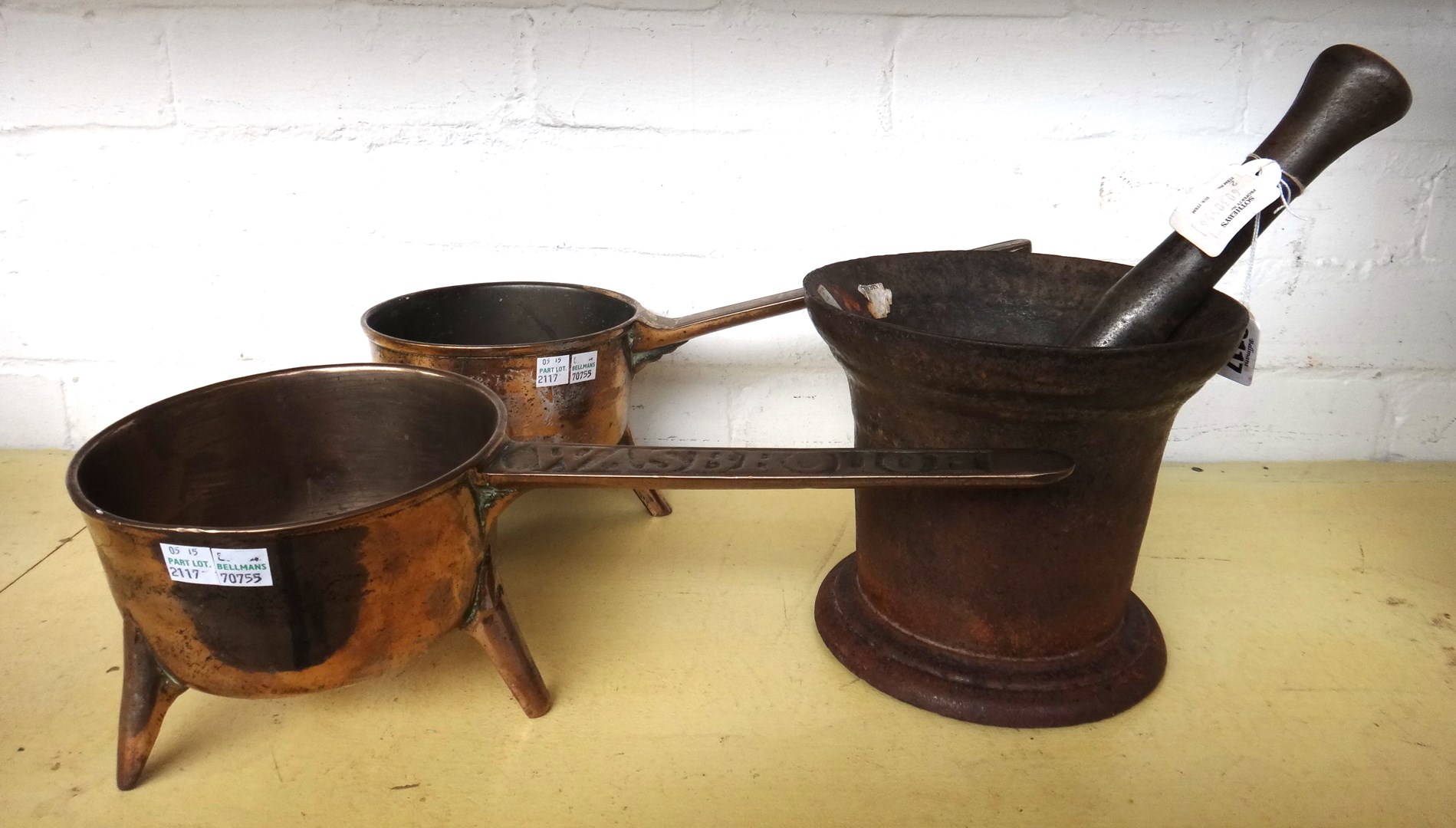 Appraisal: A cast iron pestle and mortar of large proportions th