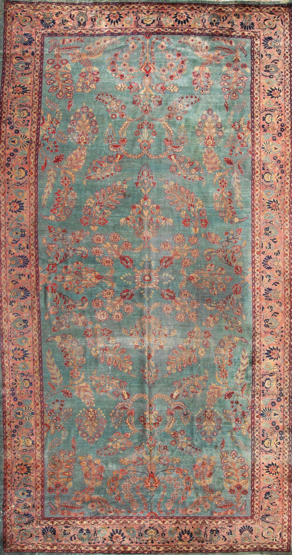 Appraisal: Large Sarouk Carpet teal ground allover floral sprays stylized border