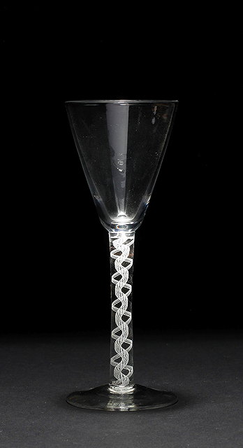 Appraisal: AN ANTIQUE WINE GLASS the conical bowl above a lace