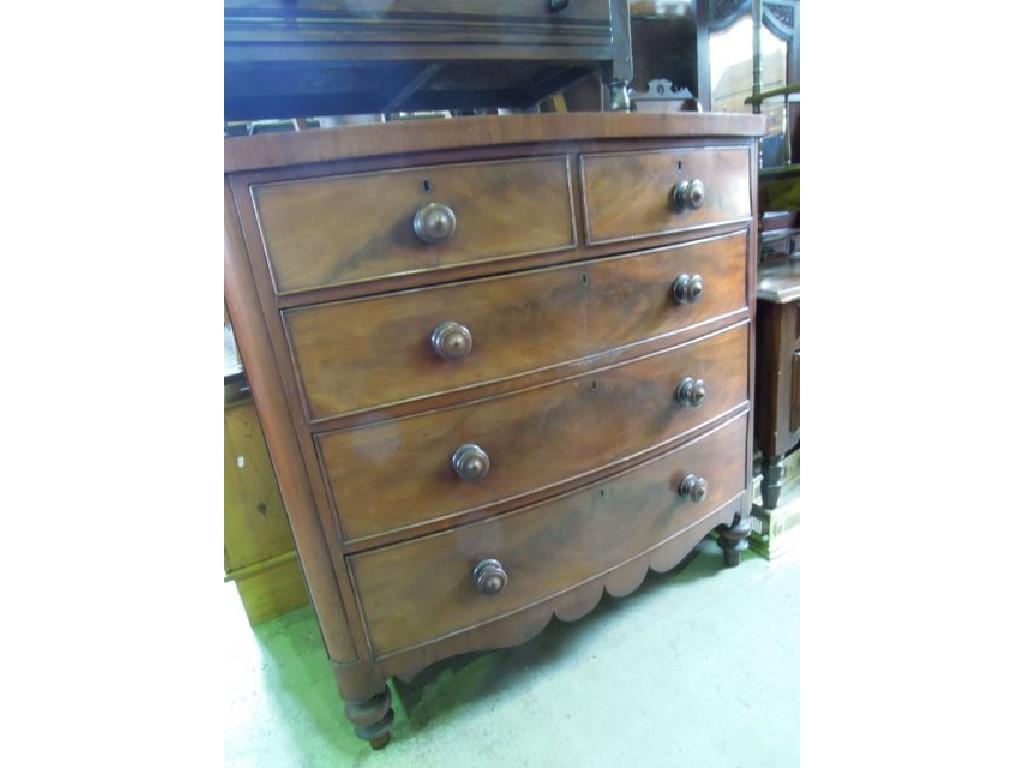 Appraisal: A Victorian mahogany bow front chest fitted with three long