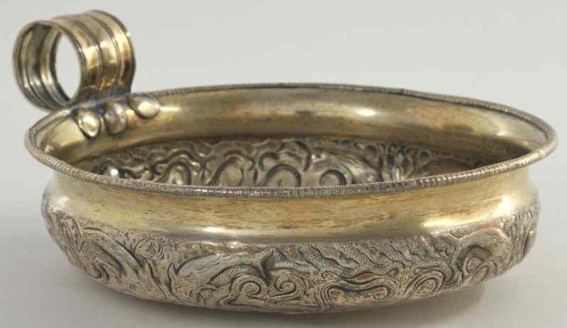 Appraisal: Egyptian Silverplate Bowlall-over octopus pattern in repousse molded strap handle