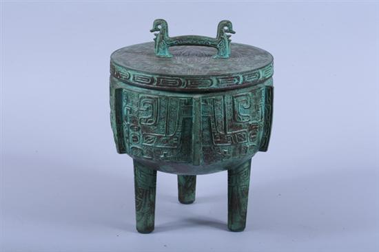 Appraisal: CHINESE PATINATED METAL VESSEL Of tripod-form with glass insert -