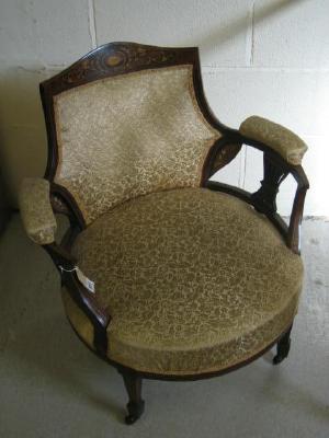 Appraisal: AN EDWARDIAN ROSEWOOD SALON CHAIR of tub form with stringing