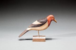 Appraisal: Woodpecker c by by inchesA painted-eye red-headed woodpecker carving with