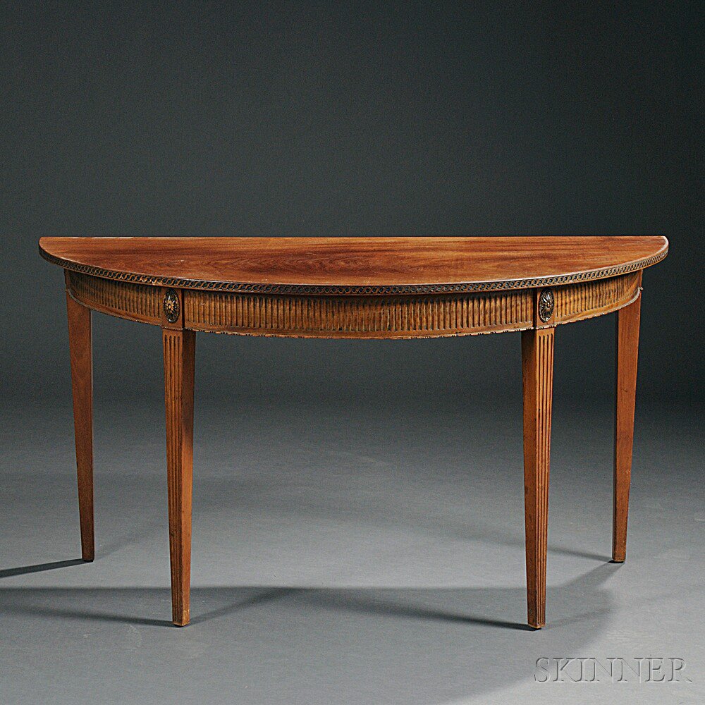 Appraisal: Neoclassical-style Mahogany Demilune Table th century the frieze with carved