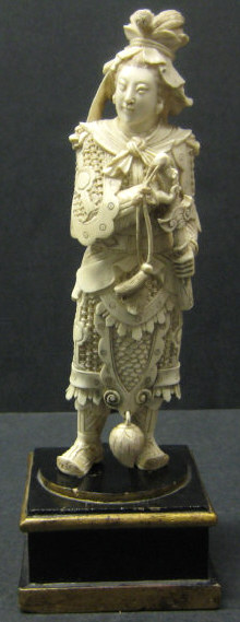 Appraisal: ASIAN CARVED IVORY WARRIOR Holding a short sword standing on