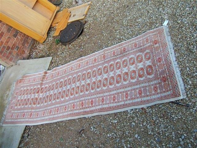 Appraisal: A Bokhara style cream ground rug with boteh to the