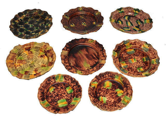 Appraisal: A GROUP OF EIGHT WHEILDON TYPE GLAZED POTTERY PLATES each