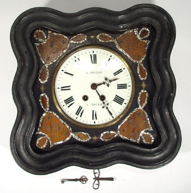 Appraisal: French wall clock in an ebonised and mother of pearl