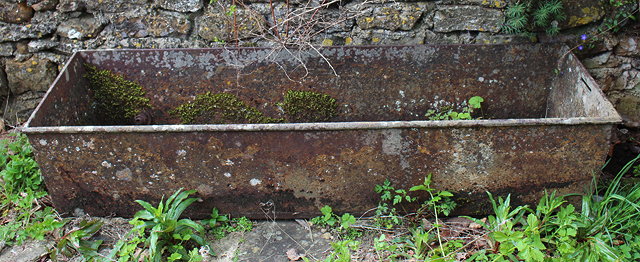 Appraisal: AN OLD RECTANGULAR CAST IRON WATERING TROUGH with ring handles