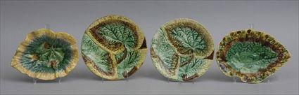 Appraisal: TWO MAJOLICA LEAF-FORM DISHES AND TWO PLATES One impressed Etruscan