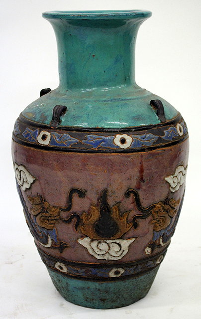 Appraisal: A VIETNAMESE TURQUOISE GLAZED TERRACOTTA FLOOR VASE of baluster form