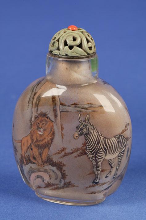 Appraisal: AN INSIDE PAINTED GLASS BOTTLE decorated with a lion zebra